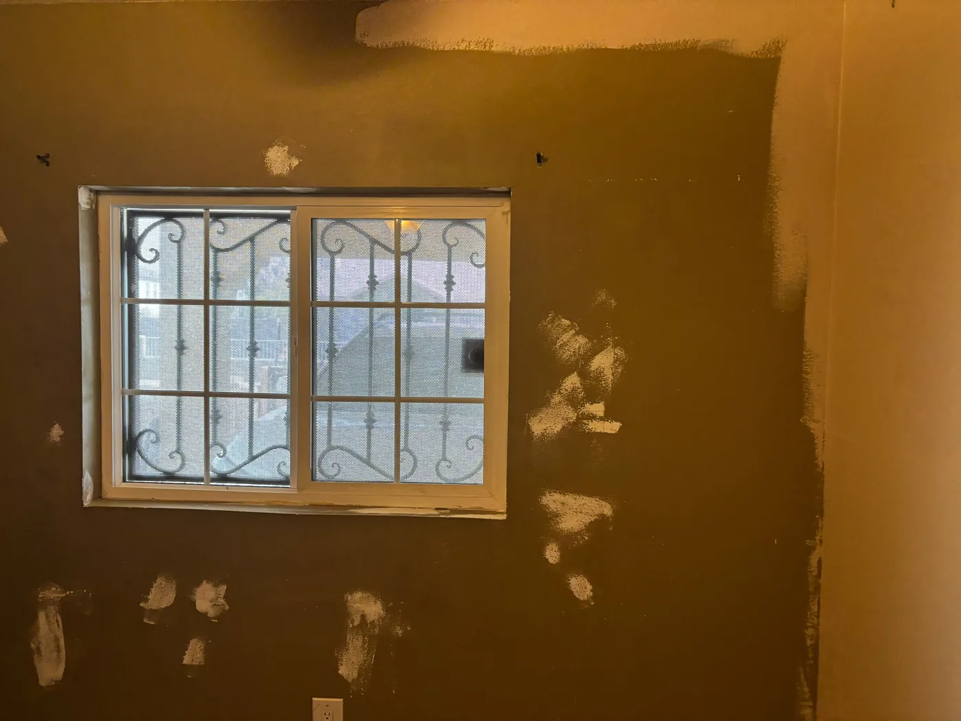 Drywall patches being finished flat